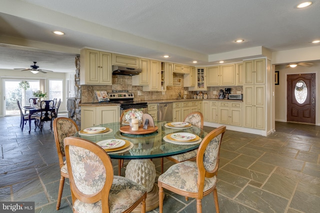 dining room with recessed lighting, baseboards, stone tile floors, and a ceiling fan