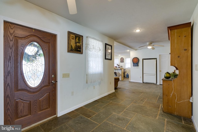 foyer entrance with stone tile floors, recessed lighting, baseboards, and a ceiling fan