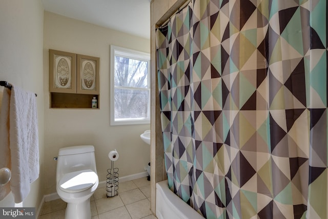 full bathroom with tile patterned floors, toilet, and baseboards