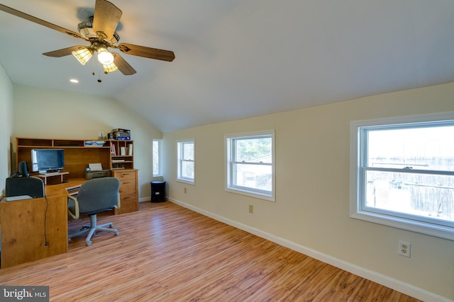 home office with vaulted ceiling, light wood-style floors, baseboards, and ceiling fan