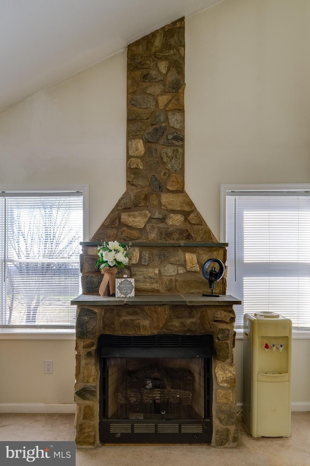 interior details featuring carpet flooring, a fireplace, and baseboards