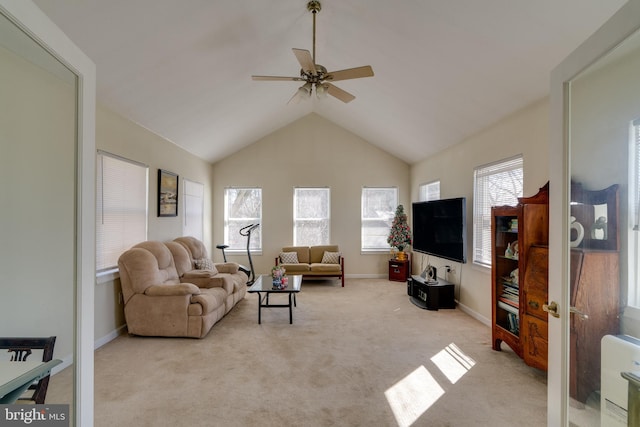 carpeted living area with vaulted ceiling, a ceiling fan, and baseboards