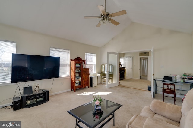 living area with high vaulted ceiling, carpet flooring, a wealth of natural light, and ceiling fan