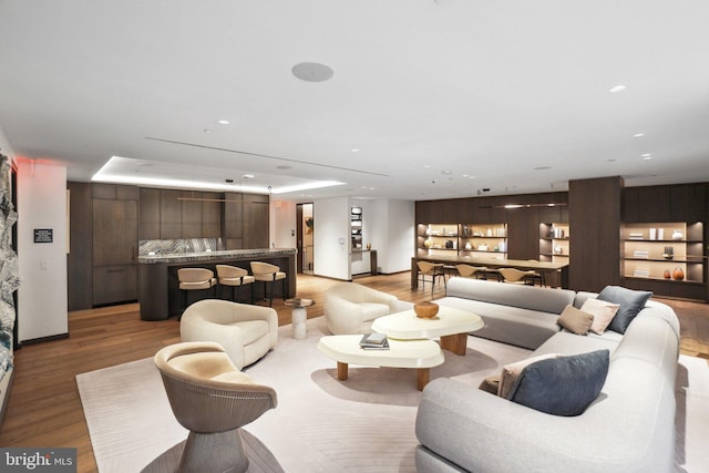 living room with recessed lighting and light wood-style floors