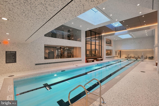 community pool featuring a skylight