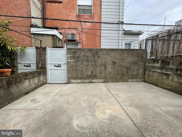 view of patio / terrace featuring a gate and fence