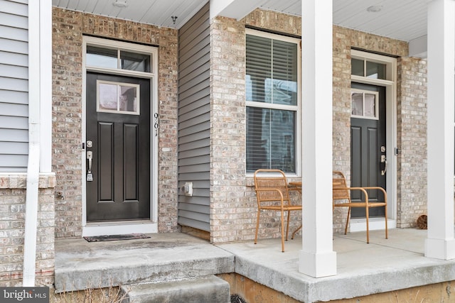 property entrance with covered porch