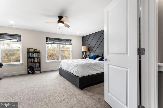 carpeted bedroom featuring visible vents, recessed lighting, a ceiling fan, and baseboards