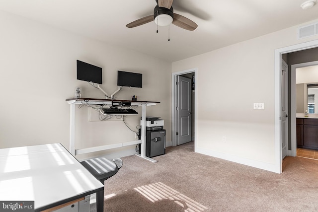 workout room with visible vents, baseboards, light colored carpet, and a ceiling fan