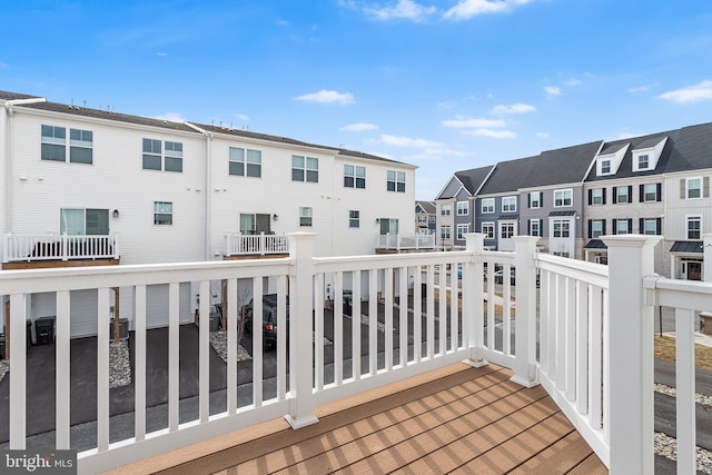 balcony with a residential view and central AC unit