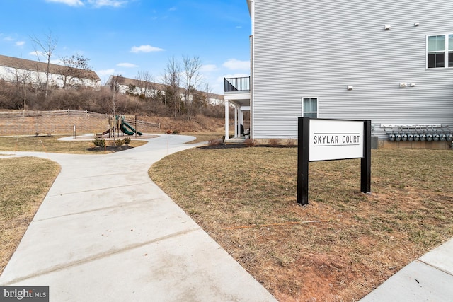 surrounding community with a lawn and a playground