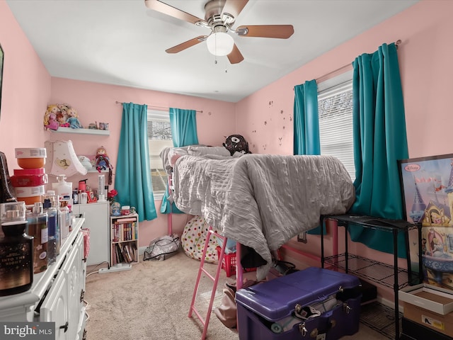 bedroom with a ceiling fan and carpet floors