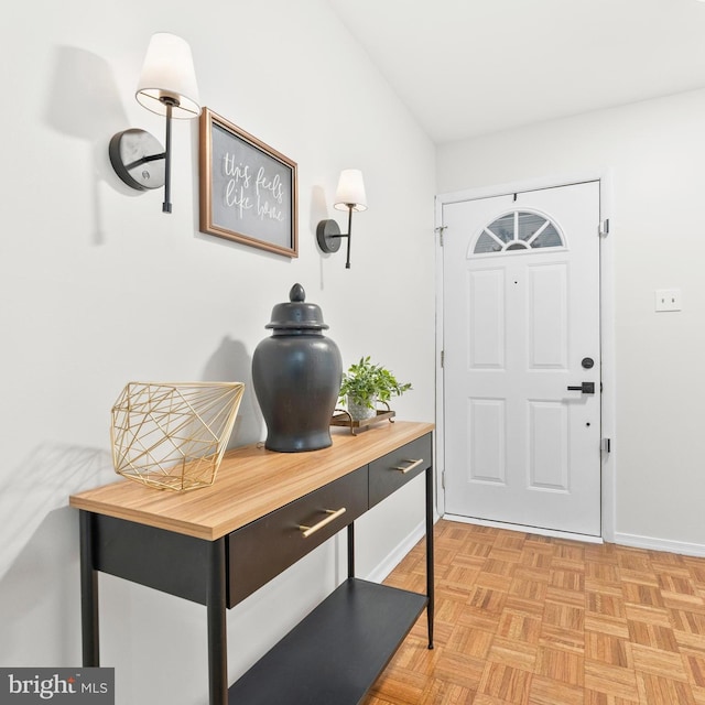 entryway featuring baseboards