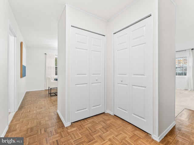 hallway featuring baseboards