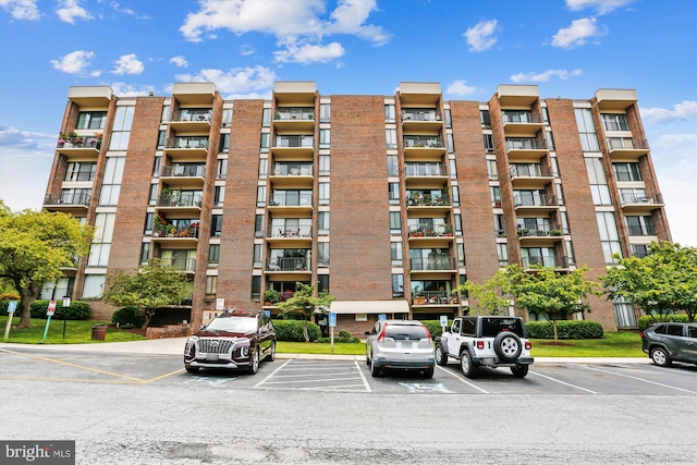 view of property featuring uncovered parking