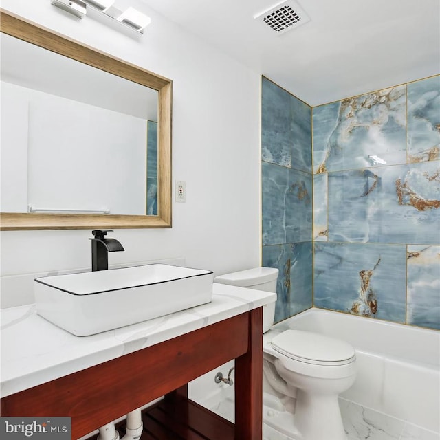 bathroom with vanity, visible vents, shower / tub combination, toilet, and marble finish floor