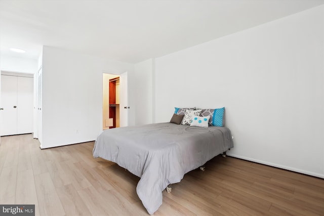 bedroom with light wood-type flooring