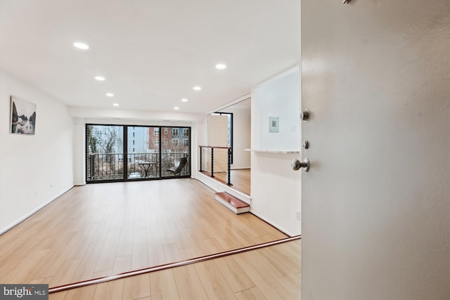 entryway featuring recessed lighting, light wood-type flooring, and baseboards