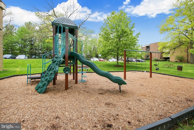 community play area with a lawn