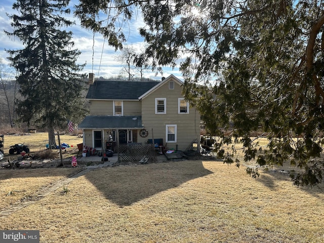 back of property with a patio