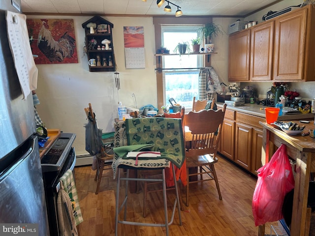 dining area with light wood-style flooring