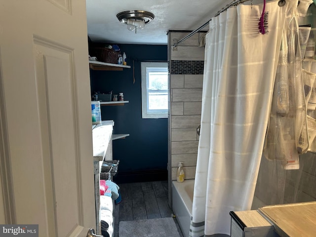 full bath with shower / bath combination with curtain and wood finished floors