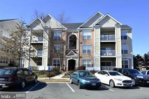 view of property with uncovered parking