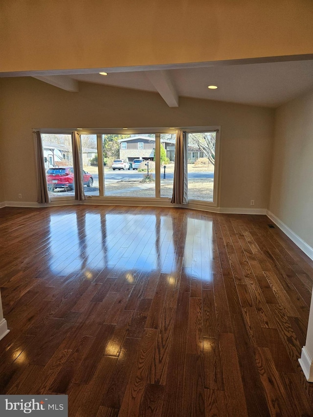 unfurnished living room with dark wood finished floors, lofted ceiling with beams, recessed lighting, and baseboards