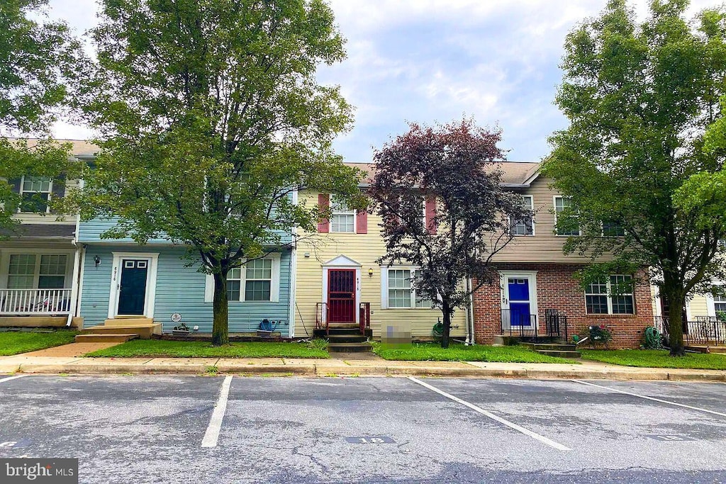 view of property with uncovered parking