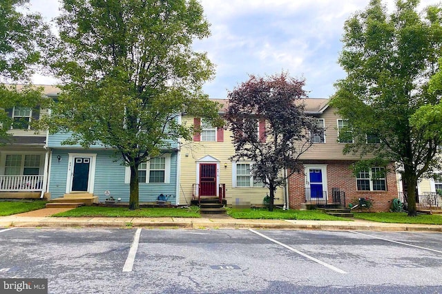 view of property with uncovered parking