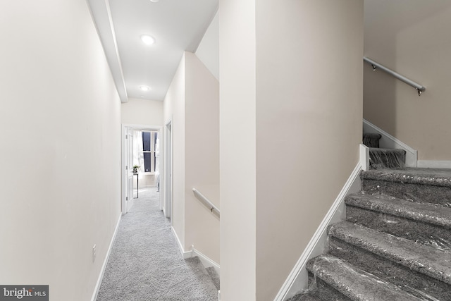 stairs with recessed lighting, baseboards, and carpet flooring
