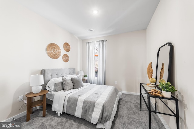 bedroom with visible vents, baseboards, and carpet