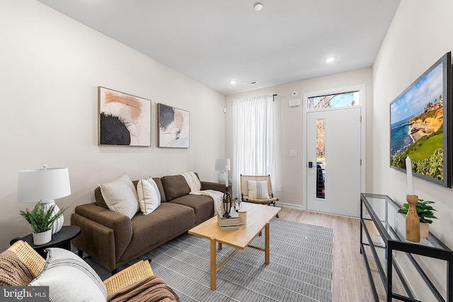 living room featuring recessed lighting and light wood-style floors