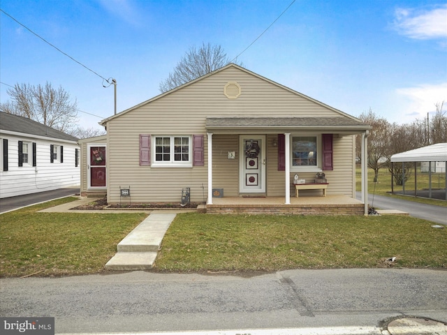 bungalow-style home with a porch and a front lawn