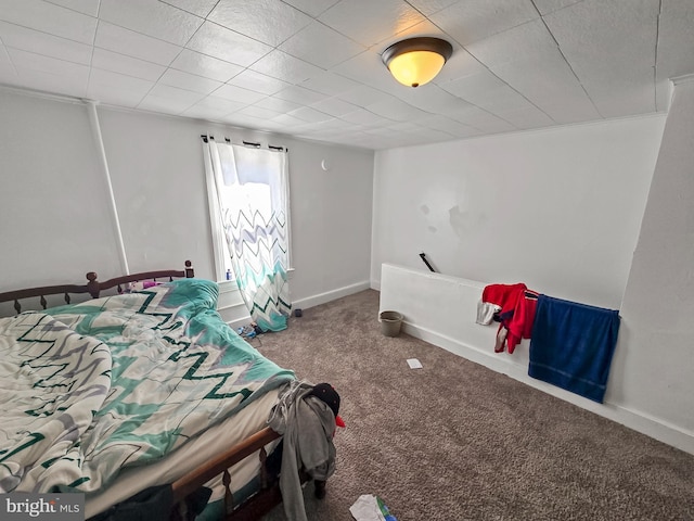 carpeted bedroom featuring baseboards