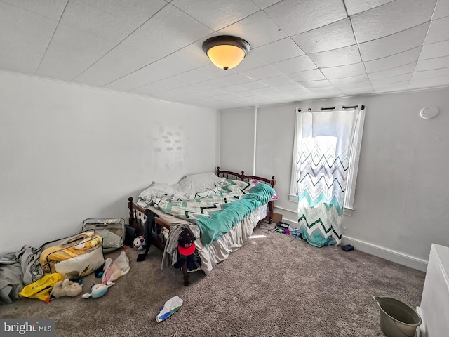 bedroom with carpet and baseboards