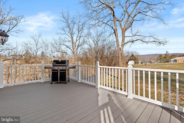 wooden deck featuring grilling area