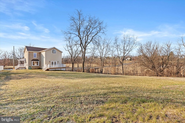 view of yard with a wooden deck