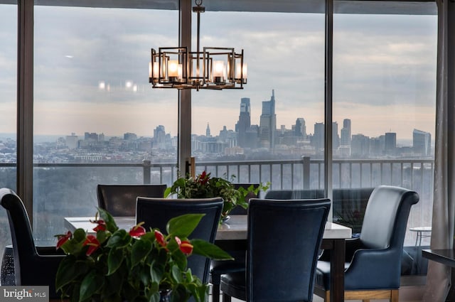 dining room featuring a notable chandelier and a view of city