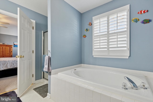 full bathroom featuring a ceiling fan, a garden tub, ensuite bath, and a shower stall