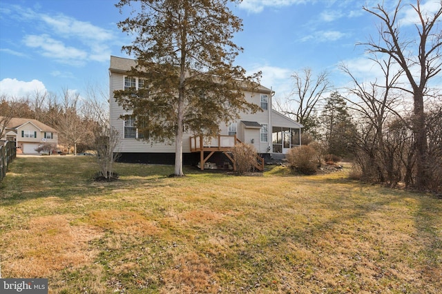 back of house with a lawn