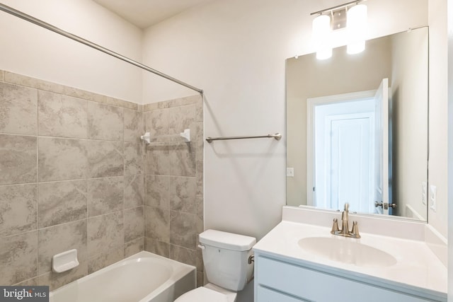 full bathroom with toilet, vanity, and shower / tub combination