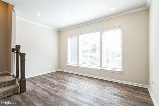 empty room with visible vents, crown molding, baseboards, dark wood finished floors, and recessed lighting