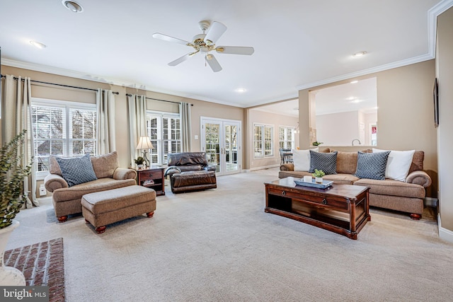 living area with baseboards, recessed lighting, ceiling fan, crown molding, and carpet flooring