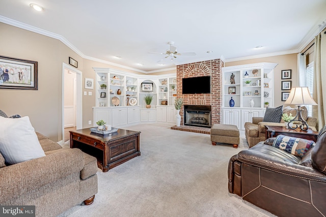 living room featuring ornamental molding, a brick fireplace, a ceiling fan, and carpet floors