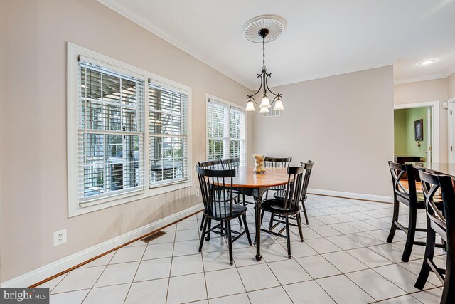 dining space featuring light tile patterned floors, visible vents, a chandelier, and baseboards