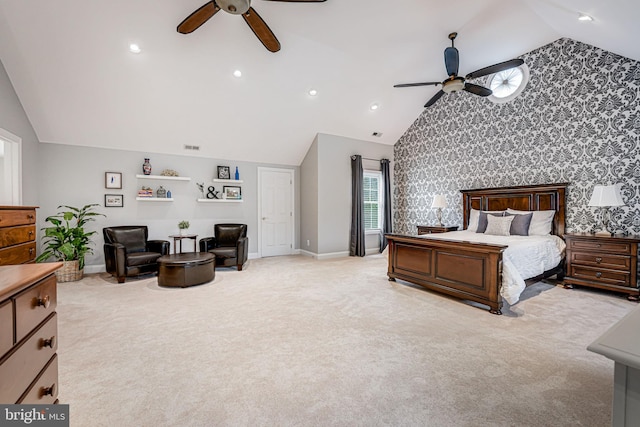 bedroom featuring wallpapered walls, an accent wall, baseboards, and light carpet