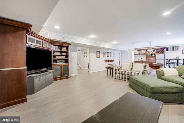 living area featuring stairs, recessed lighting, light wood-style floors, and visible vents