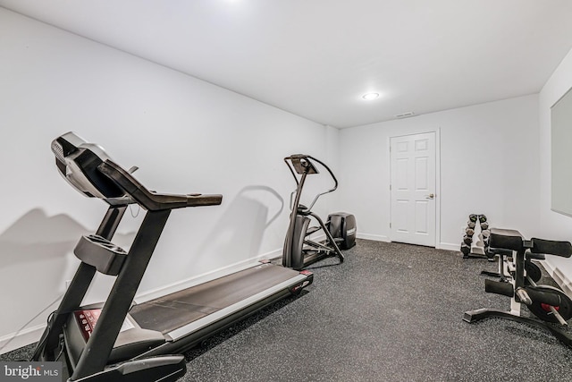 exercise room featuring visible vents and baseboards