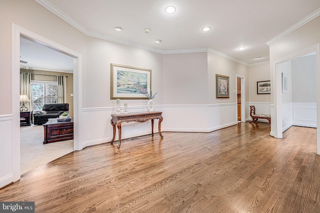 interior space with recessed lighting, wood finished floors, and ornamental molding